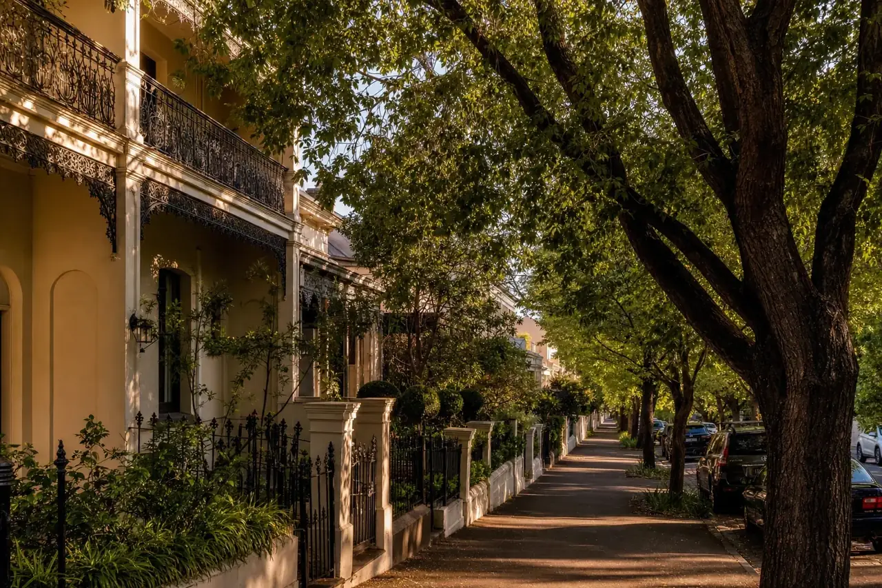 A quiet leafy Melbourne suburban street with Victorian terrace homes and street trees